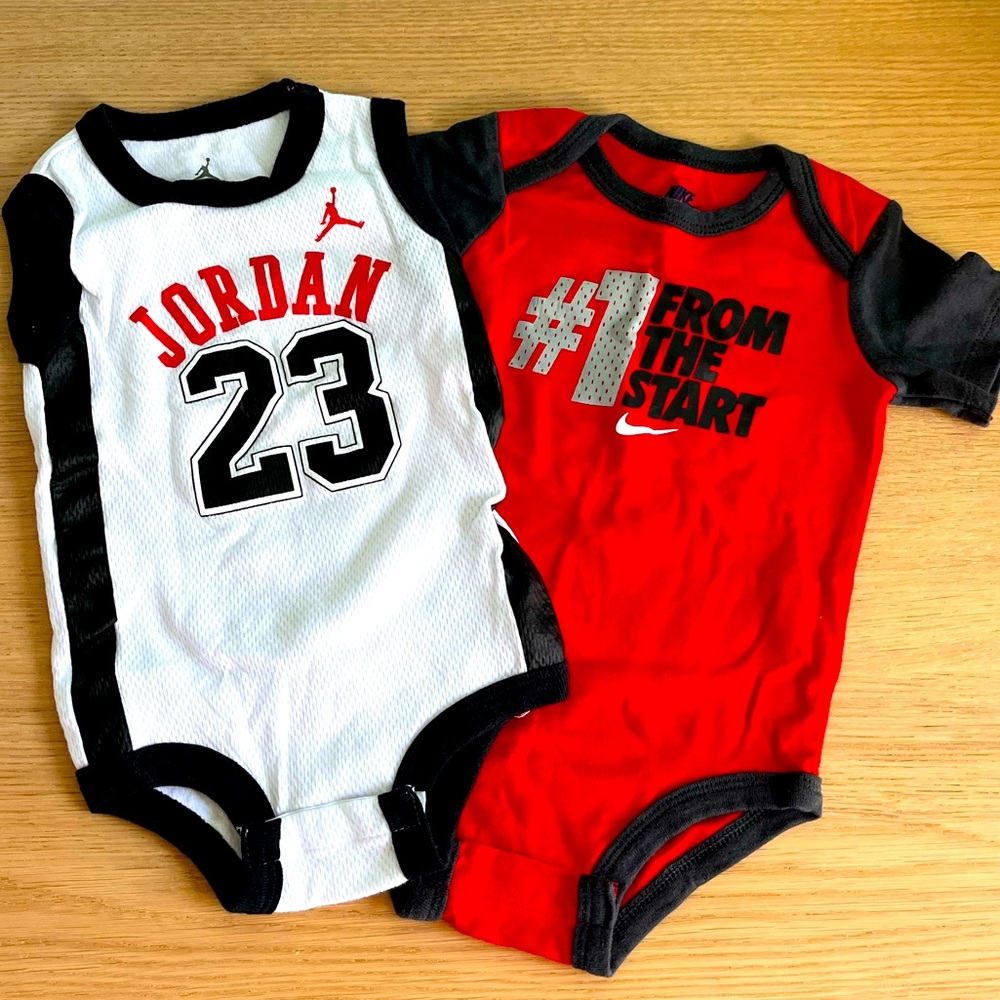 NWOT - Jordan Jersey Onesie + short sleeve Nike Onesie. Never worn